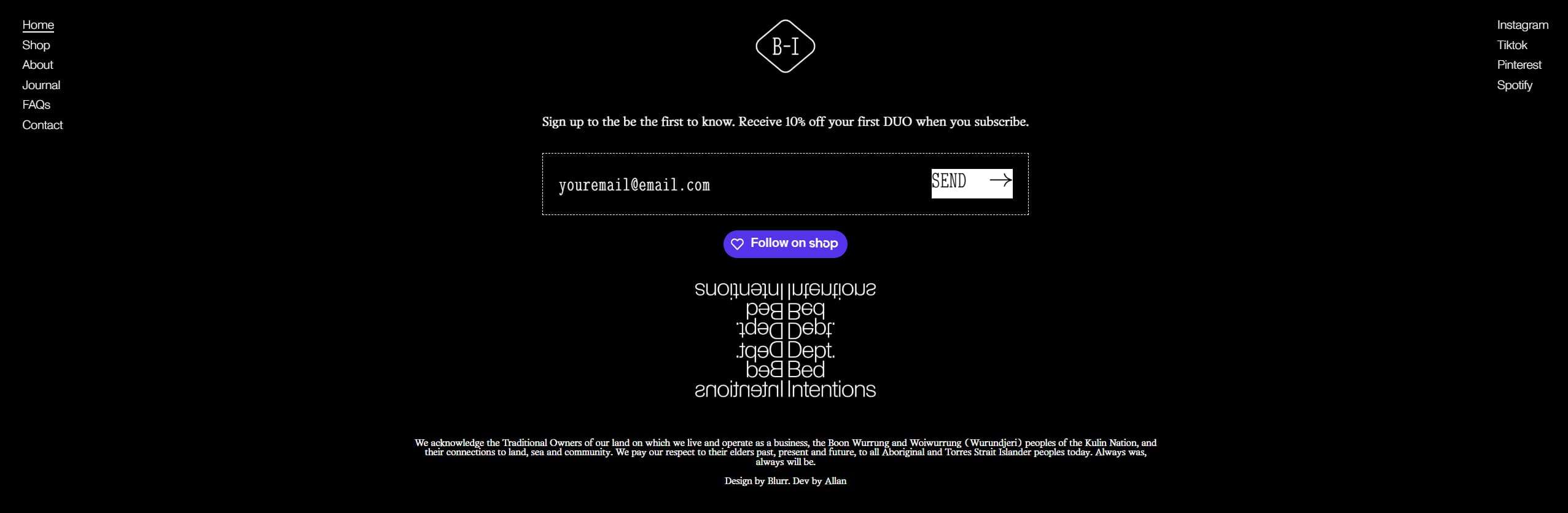 Dark website footer with centered email signup box, small logo above, and upside-down navigation text beneath.