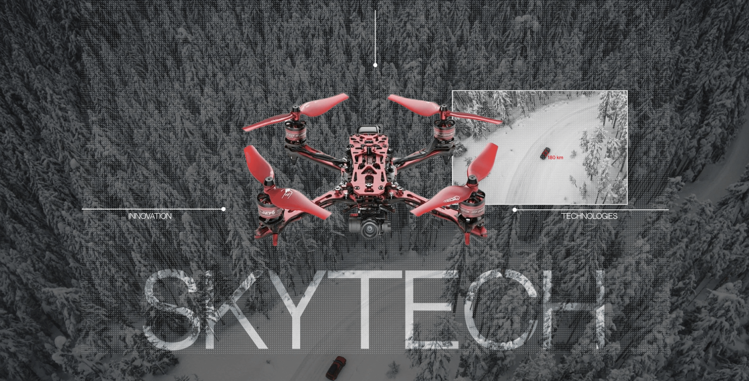 A glossy red quadcopter hovers above a desaturated, textured aerial forest scene.